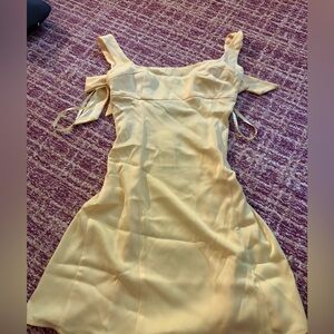 Urban yellow mini dress with bows